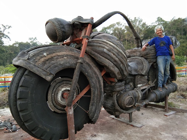 nana bintan pembuat patung raksasa dari ban bekas